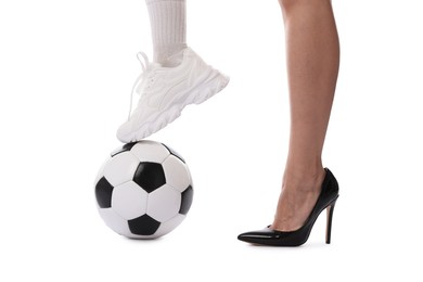 Photo of Woman in high heeled shoe and sneaker with soccer ball on white background, closeup