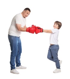 Photo of Father and his son boxing on white background