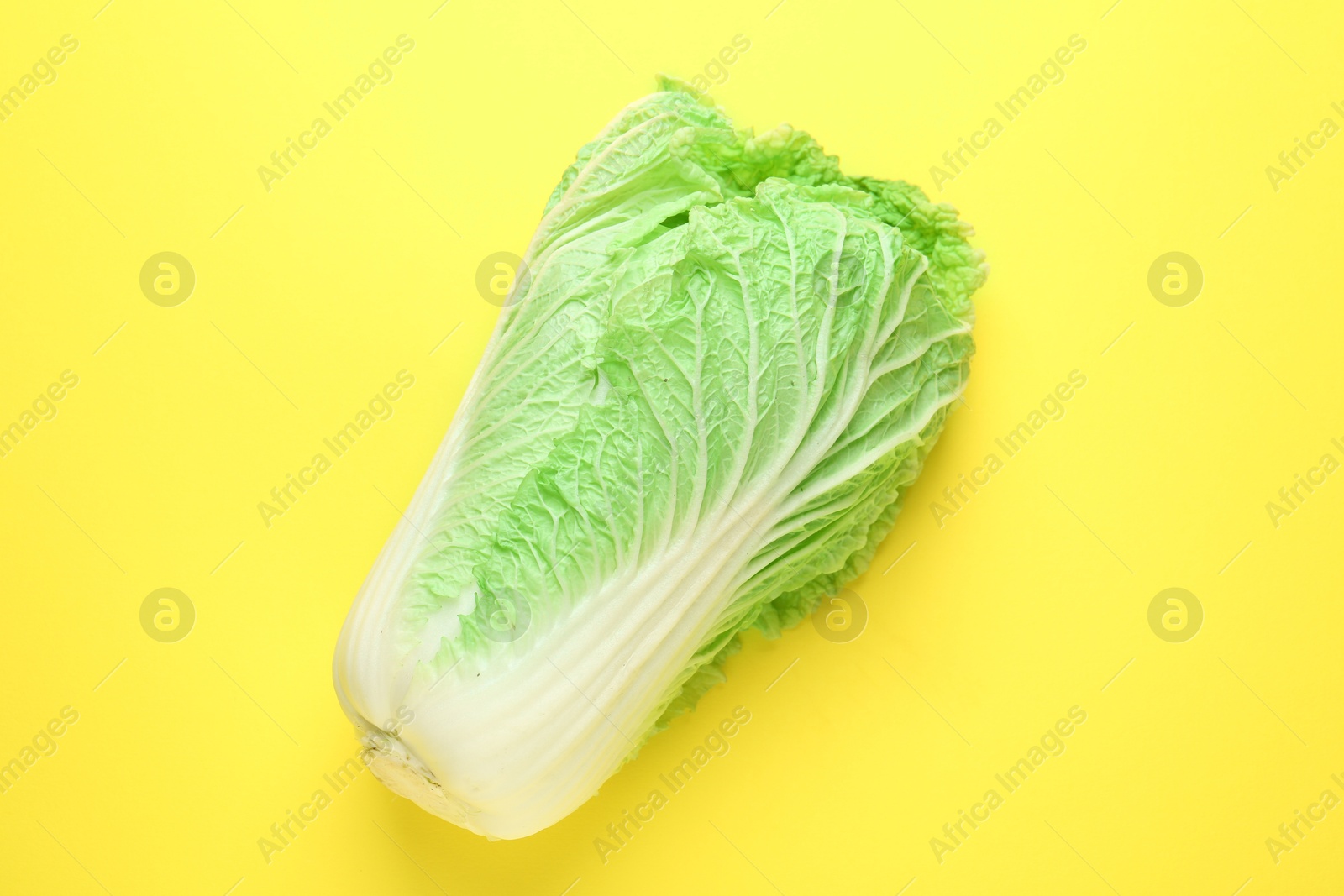 Fresh Chinese cabbage on yellow background, top view Photo of Fresh Chinese cabbage on yellow background, top view