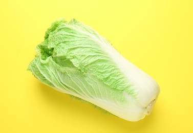Photo of Fresh Chinese cabbage on yellow background, top view