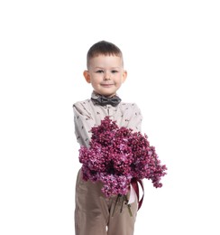 Photo of Little boy with bouquet of lilac flowers on white background