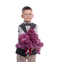 Photo of Little boy with bouquet of lilac flowers on white background