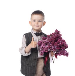 Photo of Little boy with bouquet of lilac flowers showing thumbs up on white background