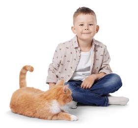 Photo of Little boy with her cute ginger cat on white background