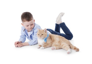 Photo of Little boy with her cute ginger cat on white background