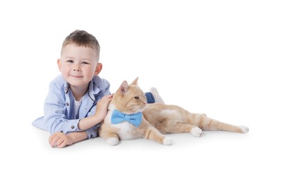 Photo of Little boy with her cute ginger cat on white background