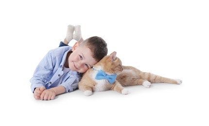 Photo of Little boy with her cute ginger cat on white background