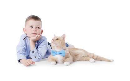 Photo of Little boy with her cute ginger cat on white background