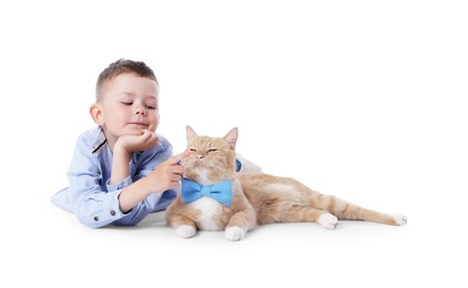 Photo of Little boy with her cute ginger cat on white background
