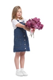 Photo of Little girl with bouquet of lilac flowers on white background