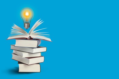 Image of Idea and knowledge. Light bulb in air over stack of books on light blue background, space for text