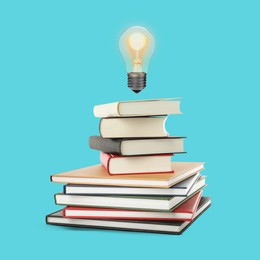 Image of Light bulb in air over stack of books against turquoise background. Idea and knowledge