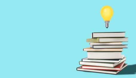 Image of Idea and knowledge. Light bulb in air over stack of books against turquoise background, space for text. Banner design