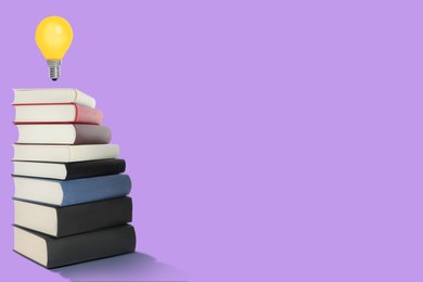 Image of Idea and knowledge. Light bulb in air over stack of books on violet background, space for text