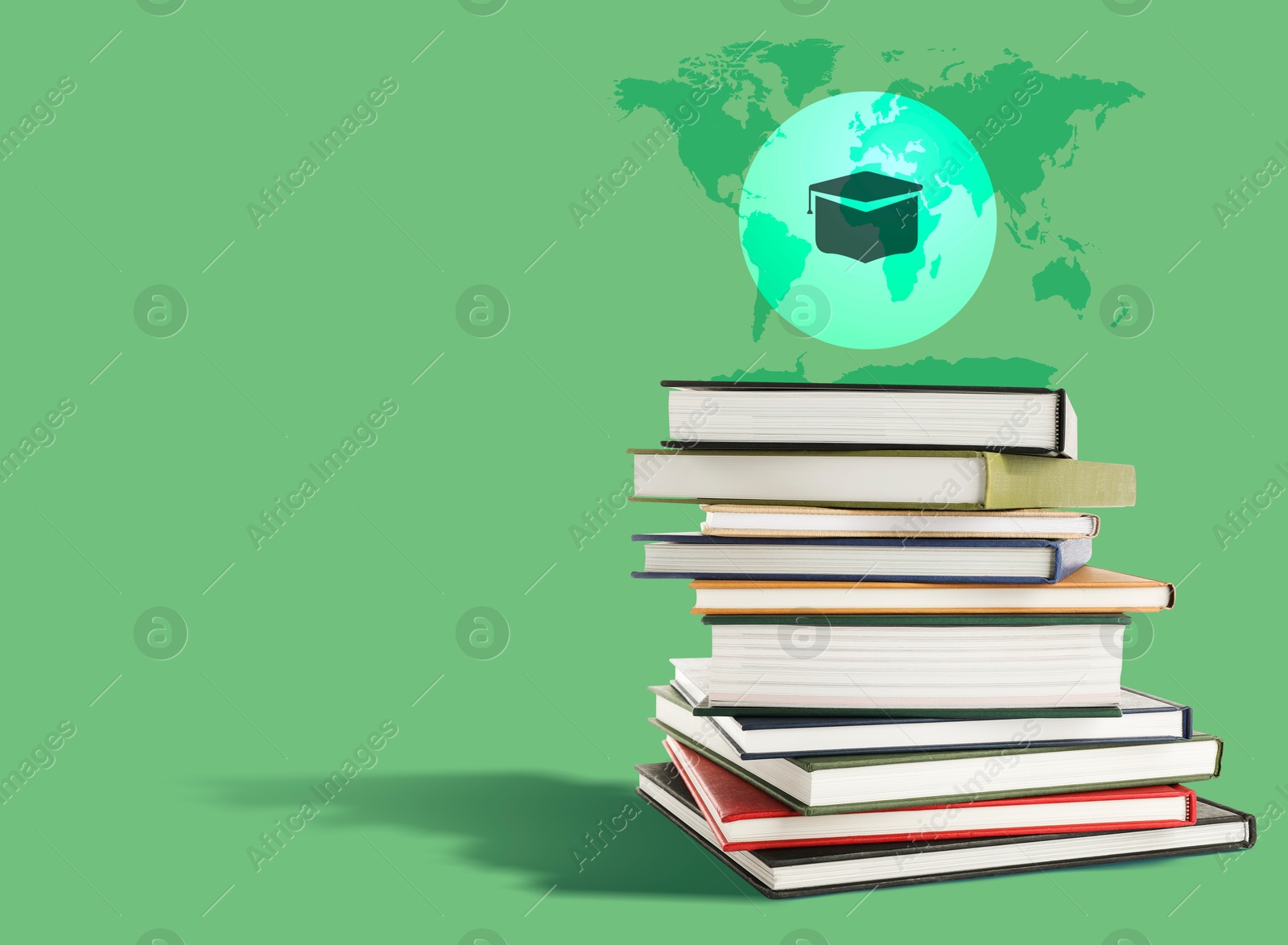 Graduate cap and world map illustrations over books on green background, space for text Image of Graduate cap and world map illustrations over books on green background, space for text