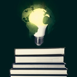 Image of Light bulb with globe illustration in air over stack of books on dark background. Idea and knowledge