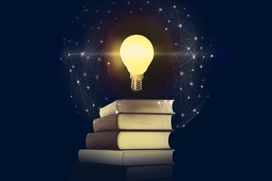 Image of Light bulb in air over stack of books and virtual network on dark blue background. Idea and knowledge
