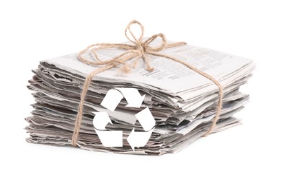 Image of Recycling symbol and stack of tied newspapers on white background. Eco-friendly lifestyle, reusing