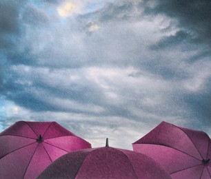 Image of Purple umbrellas under heavy rain. Stormy weather