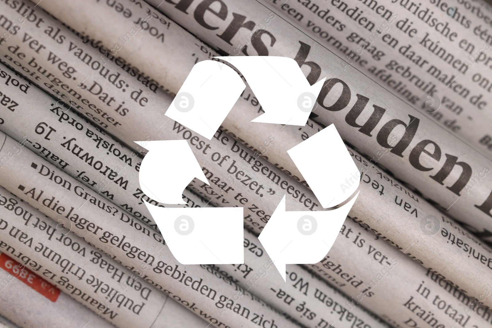 Recycling symbol and many newspapers in different languages as background, closeup. Eco-friendly lifestyle, reusing Image of Recycling symbol and many newspapers in different languages as background, closeup. Eco-friendly lifestyle, reusing