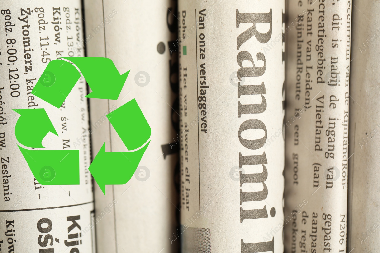 Recycling symbol and many newspapers as background, closeup. Eco-friendly lifestyle, reusing Image of Recycling symbol and many newspapers as background, closeup. Eco-friendly lifestyle, reusing
