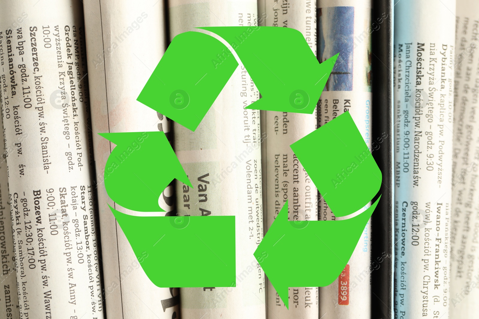 Recycling symbol and many newspapers in different languages as background, closeup. Eco-friendly lifestyle, reusing Image of Recycling symbol and many newspapers in different languages as background, closeup. Eco-friendly lifestyle, reusing