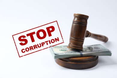 Image of Stop corruption. Law gavel with stack of dollars on white background