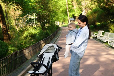 Photo of Mother with her cute baby in park