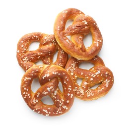 Photo of Tasty pretzels with salt isolated on white, top view