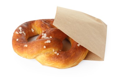 Photo of Tasty pretzel with salt in paper package isolated on white