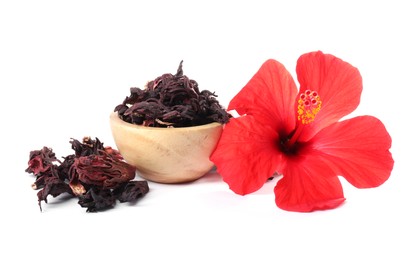 Photo of Hibiscus tea. Dried roselle sepals in bowl and beautiful flower isolated on white