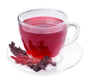 Photo of Delicious hibiscus tea in glass cup and dry roselle sepals isolated on white