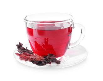 Photo of Delicious hibiscus tea in glass cup and dry roselle sepals isolated on white