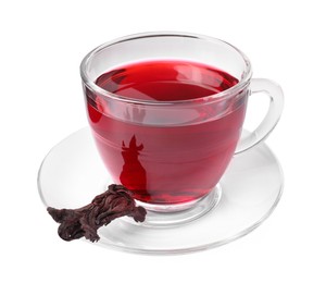 Photo of Delicious hibiscus tea in glass cup and dry roselle sepal isolated on white