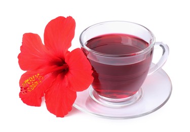 Photo of Delicious hibiscus tea in glass cup and beautiful flower isolated on white