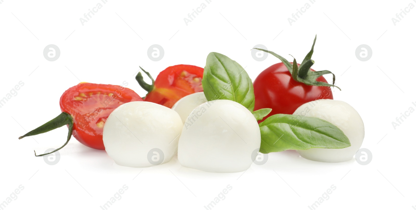 Tasty mozzarella cheese balls, tomatoes and basil isolated on white Photo of Tasty mozzarella cheese balls, tomatoes and basil isolated on white