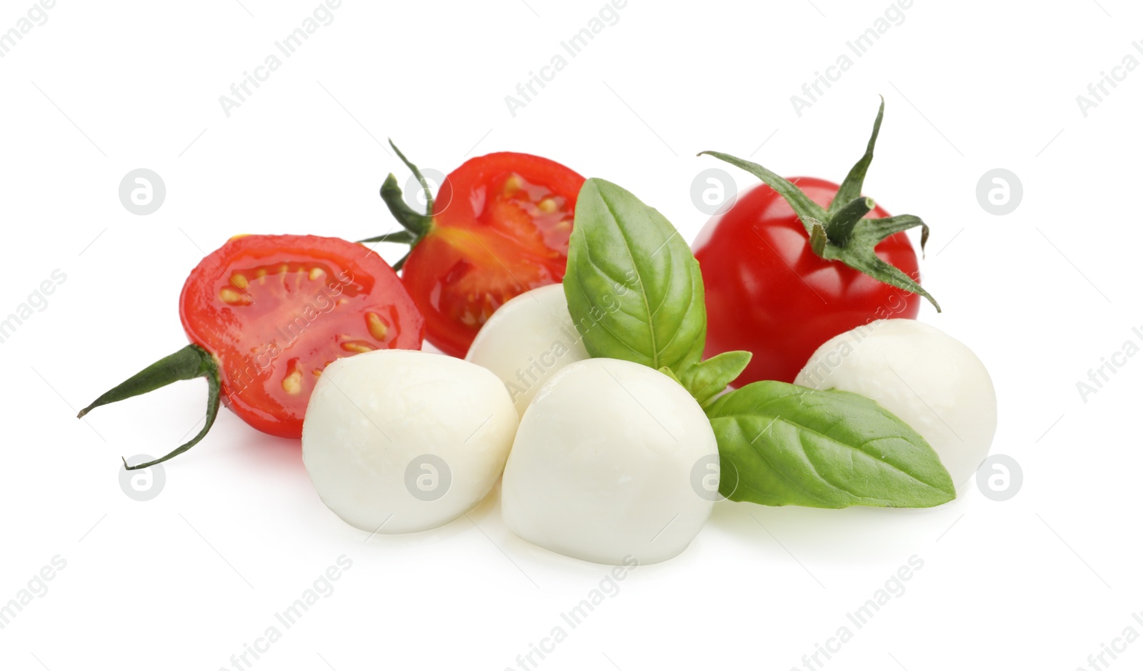 Tasty mozzarella cheese balls, tomatoes and basil isolated on white Photo of Tasty mozzarella cheese balls, tomatoes and basil isolated on white