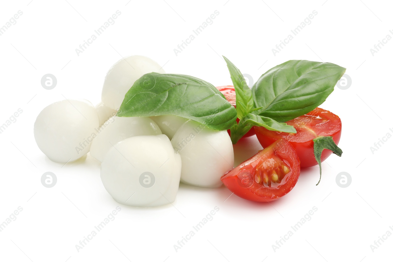 Tasty mozzarella cheese balls, tomatoes and basil isolated on white Photo of Tasty mozzarella cheese balls, tomatoes and basil isolated on white