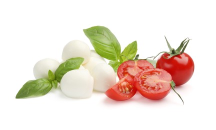 Photo of Tasty mozzarella cheese balls, tomatoes and basil isolated on white