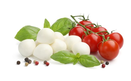 Photo of Tasty mozzarella cheese balls, tomatoes, peppercorns and basil isolated on white