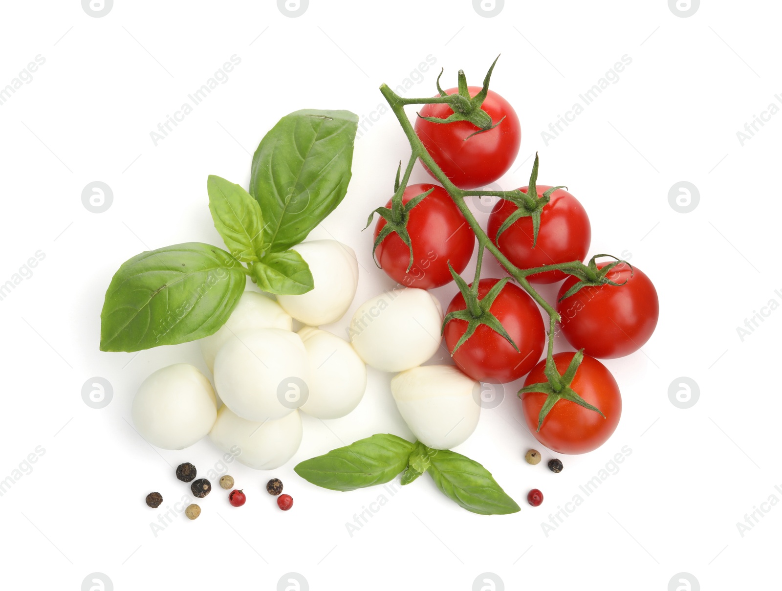 Photo of Tasty mozzarella cheese balls, tomatoes, peppercorns and basil isolated on white, top view