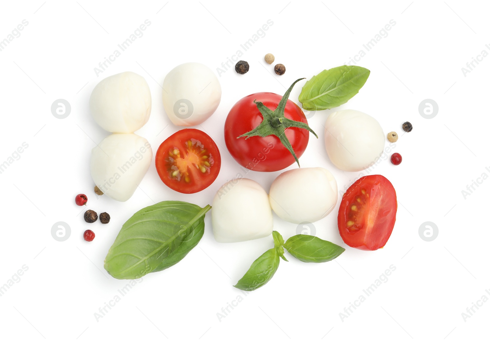 Tasty mozzarella cheese balls, tomatoes, peppercorns and basil isolated on white, top view Photo of Tasty mozzarella cheese balls, tomatoes, peppercorns and basil isolated on white, top view