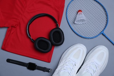Photo of Flat lay composition with sportswear on grey background