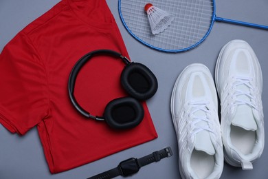 Photo of Flat lay composition with sportswear on grey background