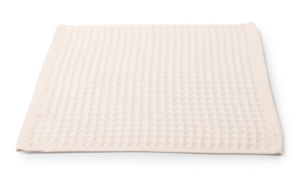 Photo of Clean beige waffle towel isolated on white