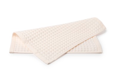 Photo of Clean beige waffle towel isolated on white