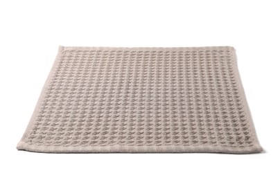 Photo of Clean brown waffle towel isolated on white