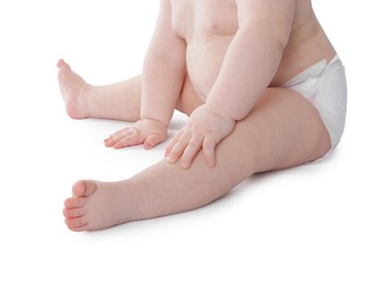 Photo of Cute little baby in diaper on white background, closeup