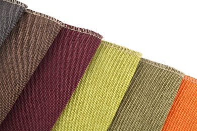 Photo of Samples of different fabrics isolated on white, top view