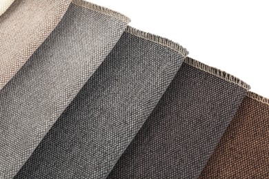 Photo of Samples of different fabrics isolated on white, top view